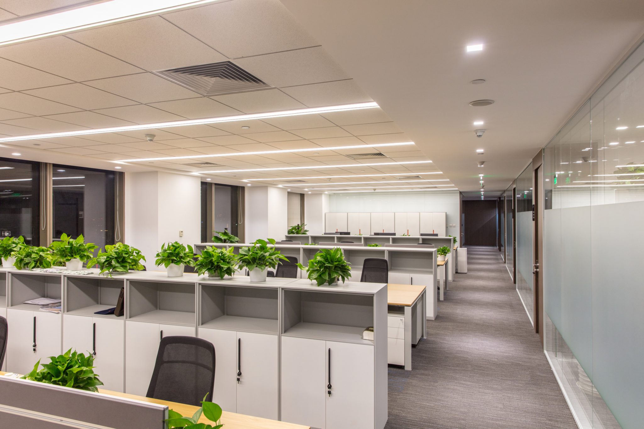 An office space upgraded with energy-efficient LED lighting to improve commercial building energy performance in Denver.