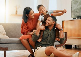 A happy family enjoying quality time together at home in the living room.